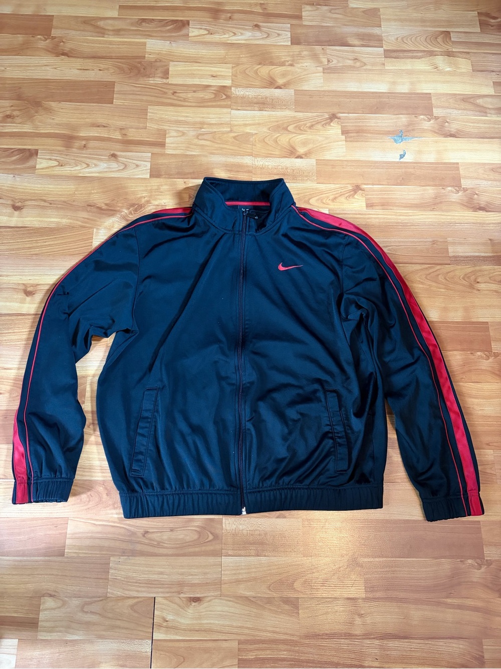 Nike Black Track Jacket with Red Stripe Accents
